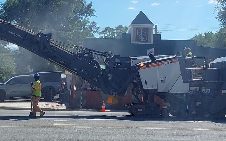 Cold planer milling the old asphalt off a road