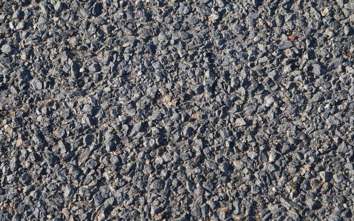 Close-up of coarse, loose dark aggregate